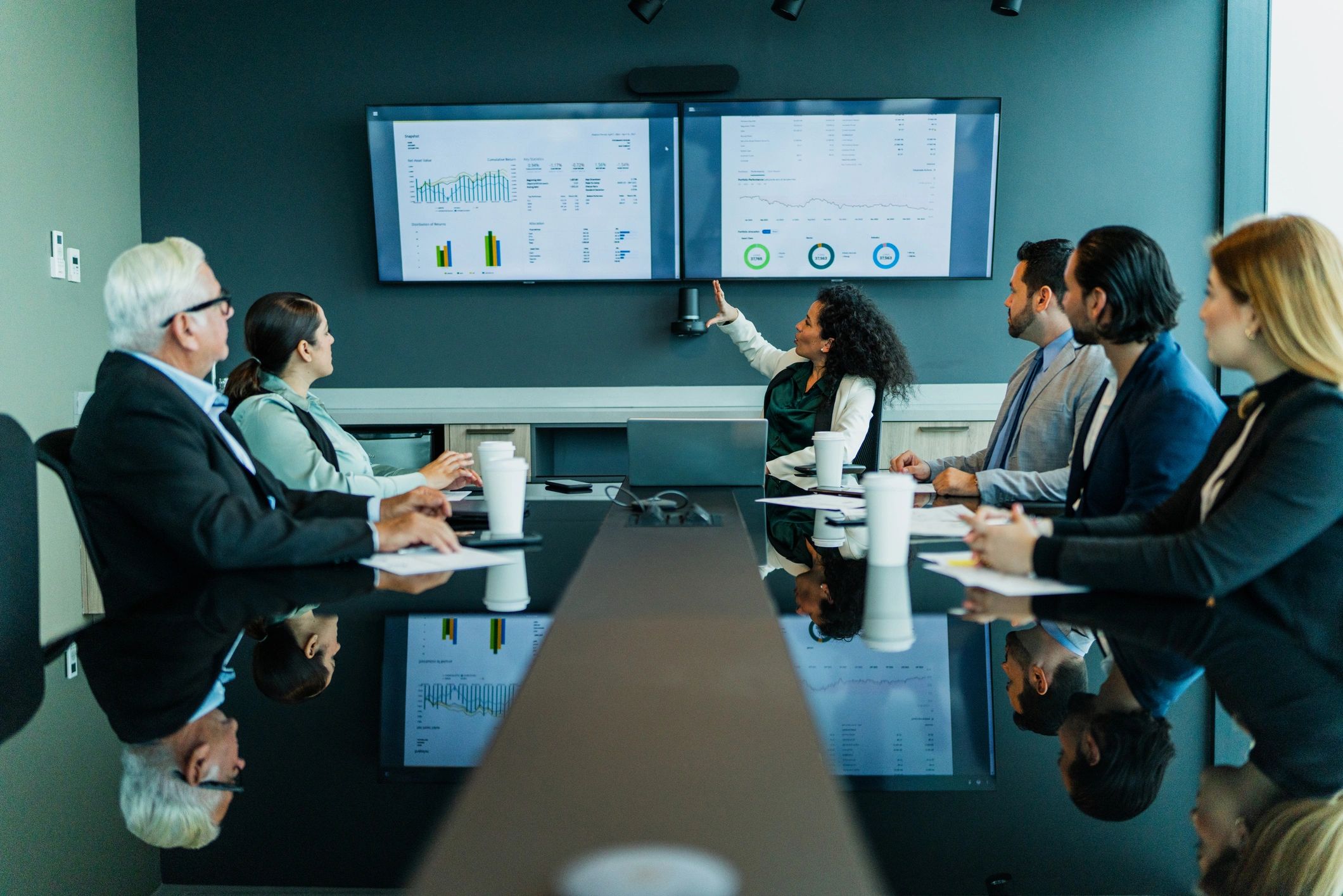 Professionals in a meeting representing collaborative legal counsel