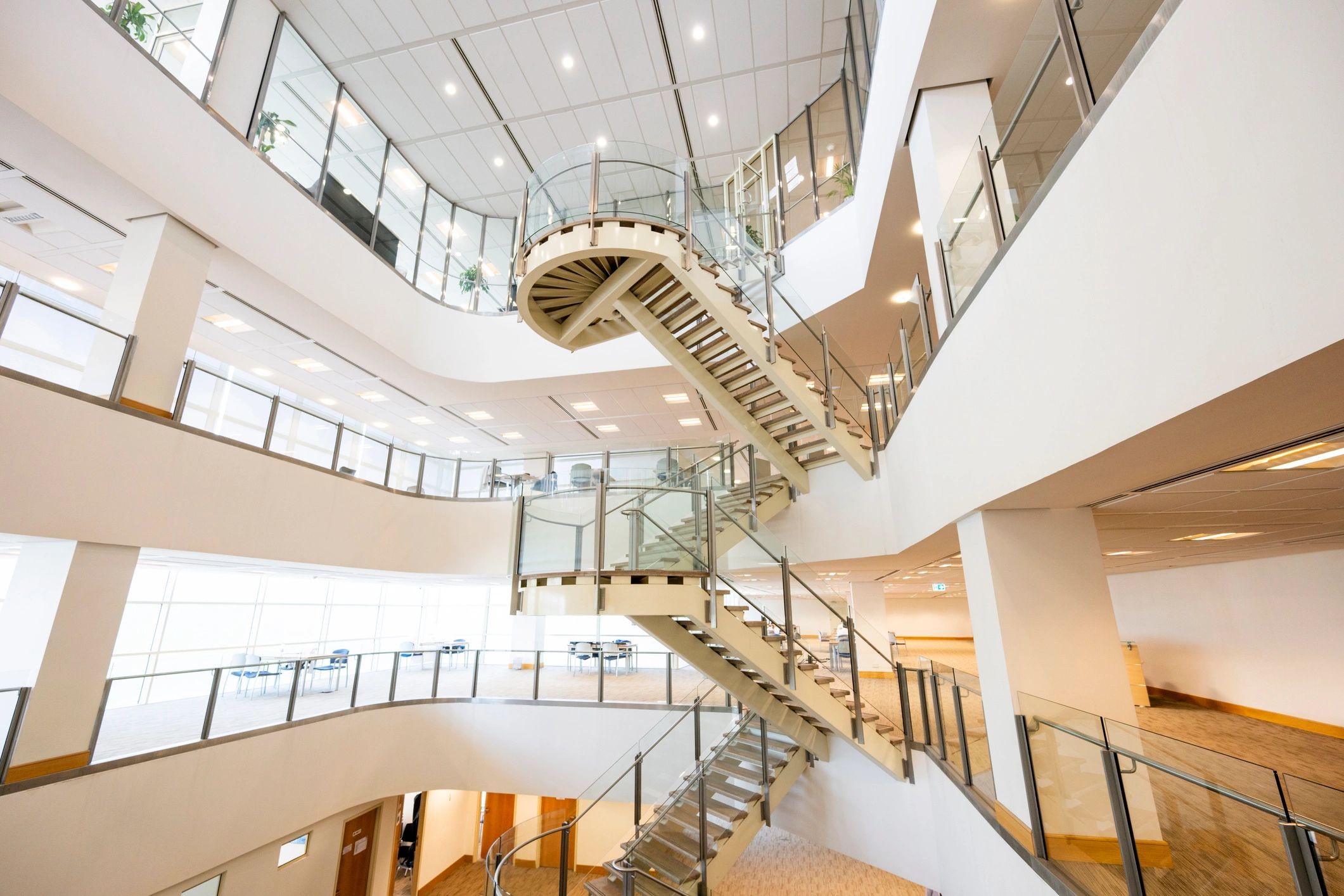 Light-filled modern architectural interior with staircase