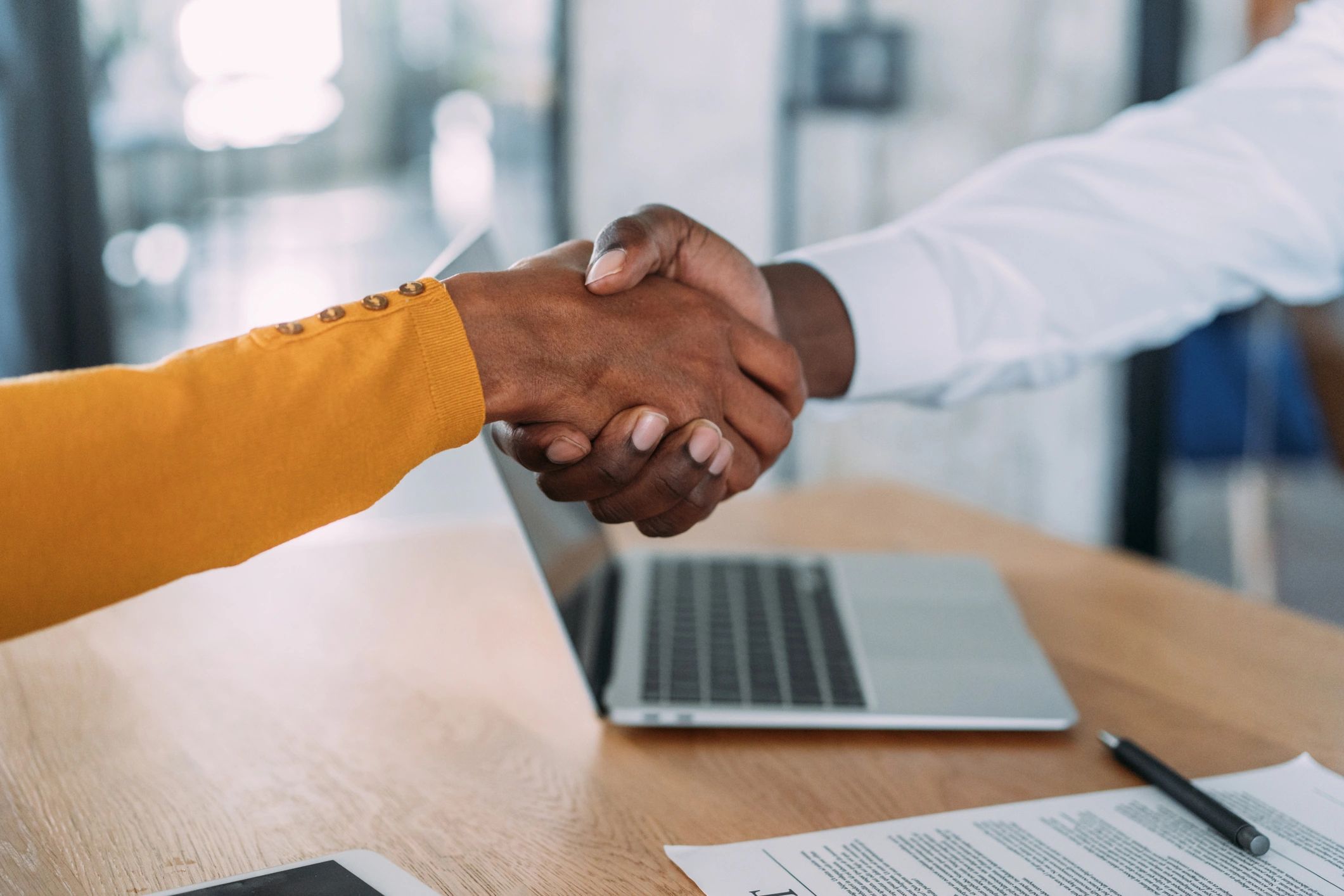 Business people shaking hands after signing a contract